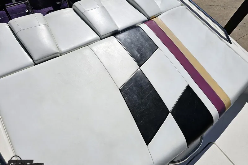 Slide: The Image of 2001 Powerquest 340 Vyper boat seat with white, black, purple, and gold upholstery design. - 45