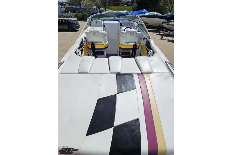 Slide: The Image of 2001 Powerquest 340 Vyper boat interior with colorful seating and dashboard. - 46