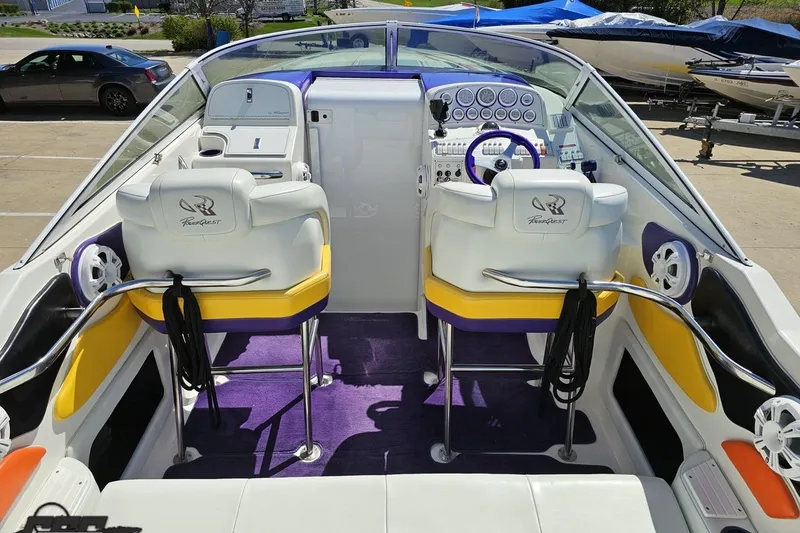 Slide: The Image of 2001 Powerquest 340 Vyper boat interior with white seats, purple accents, and control panel. - 50