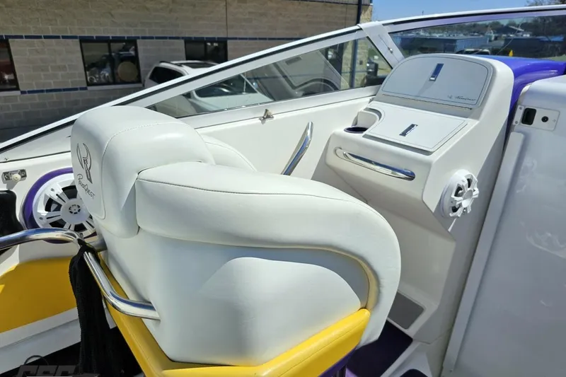 Slide: The Image of Interior of a 2001 Powerquest 340 Vyper boat with white and yellow seating. - 56