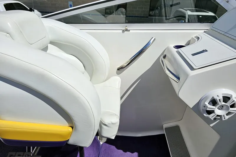 Slide: The Image of Interior of a 2001 Powerquest 340 Vyper boat, featuring white seating and dashboard controls. - 57