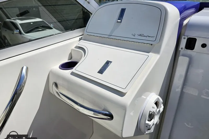 Slide: The Image of 2001 Powerquest 340 Vyper boat dashboard with sleek design and integrated cup holder. - 58