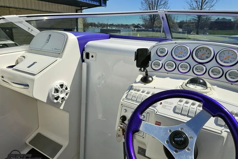 Slide: The Image of Cockpit of 2001 Powerquest 340 Vyper boat with gauges and steering wheel. - 66