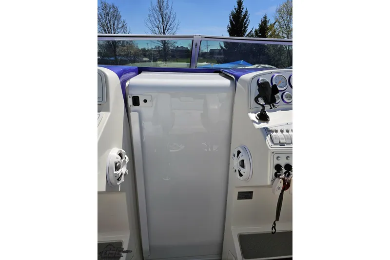 Slide: The Image of 2001 Powerquest 340 Vyper boat dashboard with gauges and controls. - 67