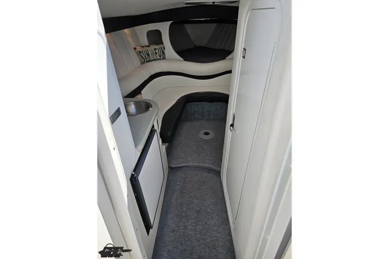 Slide: The Image of Interior cabin of 2001 Powerquest 340 Vyper boat with seating and kitchenette. - 68