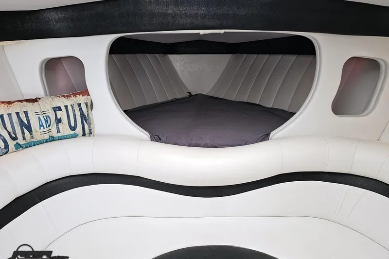 Slide: The Image of Interior cabin of 2001 Powerquest 340 Vyper boat with cozy bed and decorative pillow. - 75