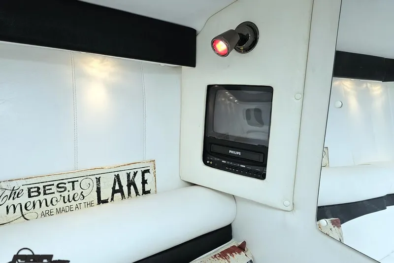 Slide: The Image of Interior of 2001 Powerquest 340 Vyper with TV and lake-themed decor. - 79