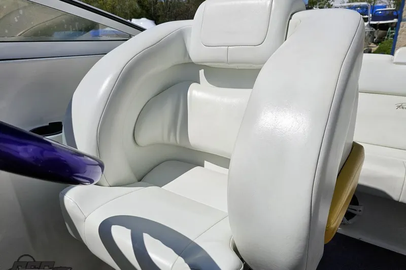 Slide: The Image of White leather seat in a 2001 Powerquest 340 Vyper boat interior. - 87