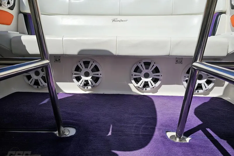 Slide: The Image of Interior of 2001 Powerquest 340 Vyper boat with speakers and purple carpet. - 88