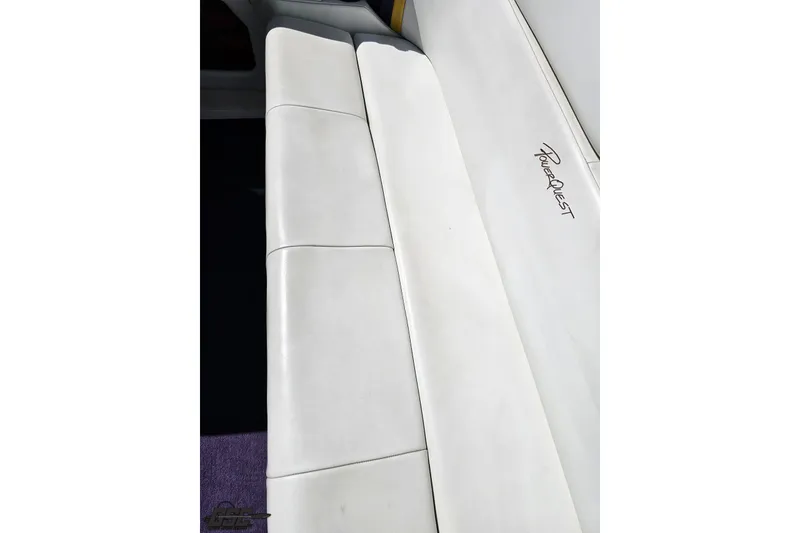 Slide: The Image of White leather seating on a 2001 Powerquest 340 Vyper boat, featuring the Powerquest logo. - 91
