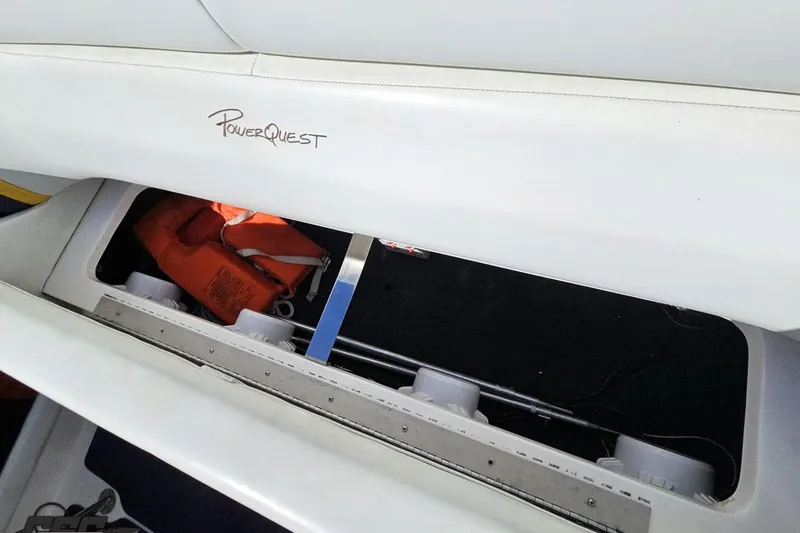 Slide: The Image of Storage compartment in a 2001 Powerquest 340 Vyper boat with life jackets. - 92
