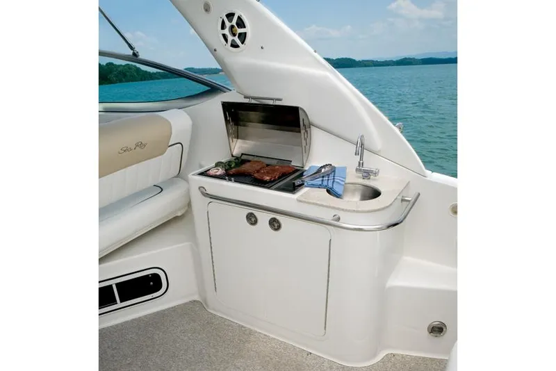 Slide: The Image of Manufacturer Provided Image: Outdoor kitchenette on a 2013 Sea Ray 280 Sundancer boat with grill and sink. - 3