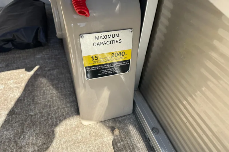 Slide: The Image of 2019 Avalon Catalina Rear Fish boat capacity label, showing limits of 15 persons or 2040 lbs. - 13