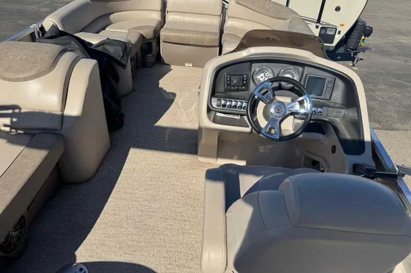 Slide: The Image of 2019 Avalon Catalina Rear Fish 25' boat interior with steering console and seating. - 14