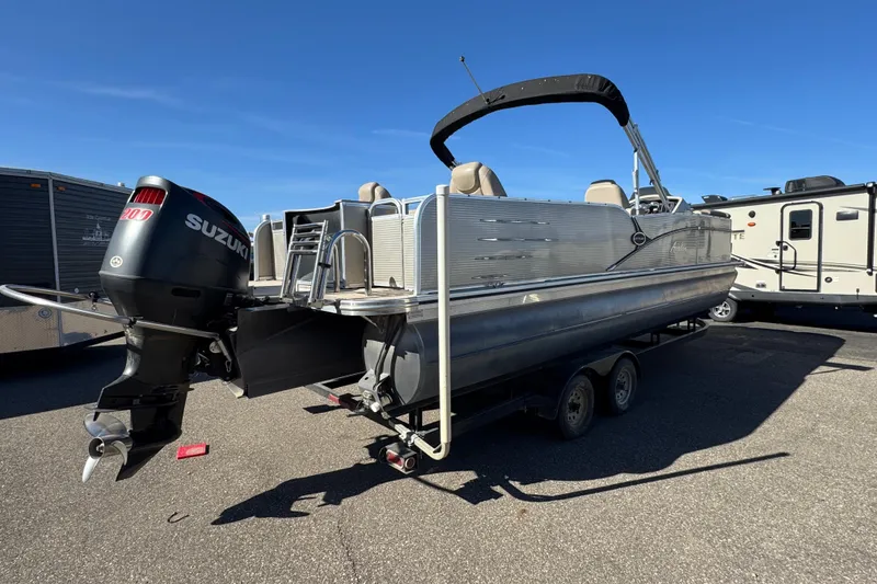 Slide: The Image of 2019 Avalon Catalina Rear Fish 25' pontoon boat with Suzuki outboard motor on trailer. - 3