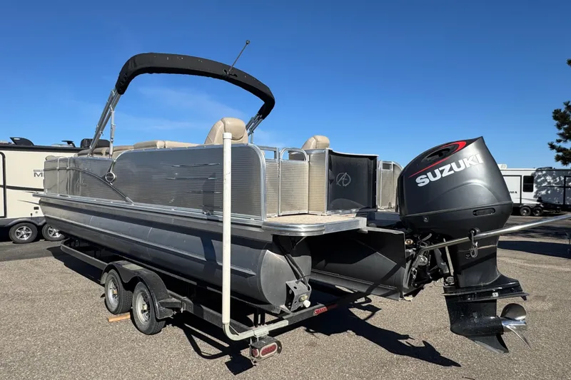 Slide: The Image of 2019 Avalon Catalina Rear Fish 25' pontoon boat with Suzuki outboard motor on trailer. - 4