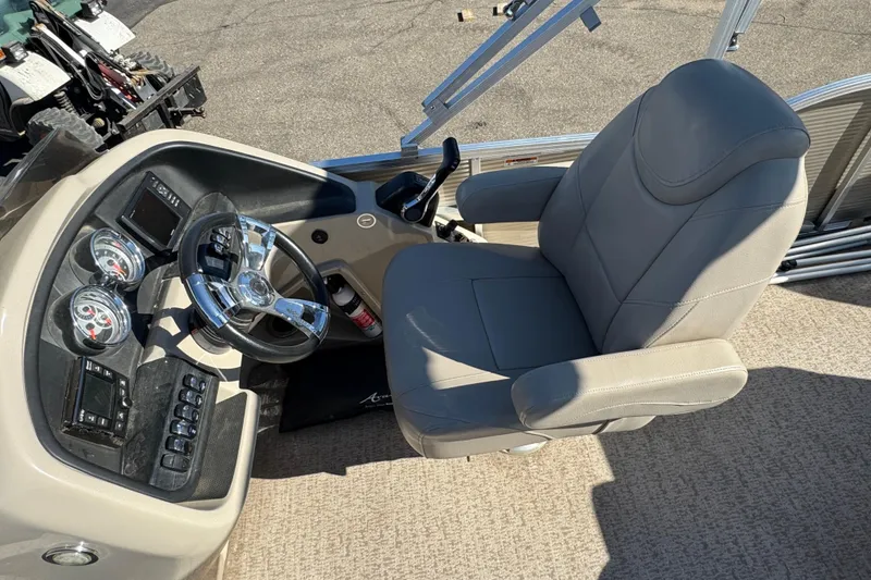 Slide: The Image of Captain's chair and dashboard of 2019 Avalon Catalina Rear Fish boat. - 7