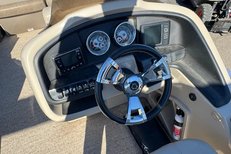 Slide: The Image of Steering console of 2019 Avalon Catalina Rear Fish boat with gauges and controls. - 8