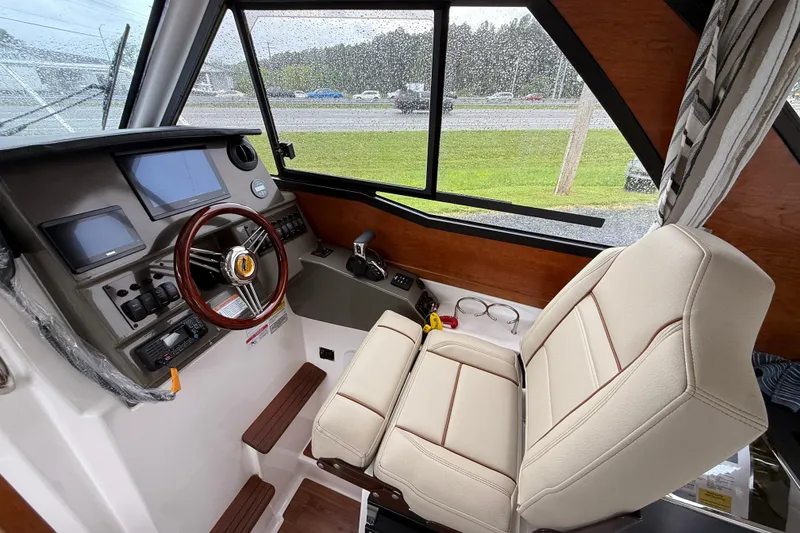 Slide: The Image of 2026 Cutwater C-248 Coupe helm with modern controls and comfortable seating. - 13