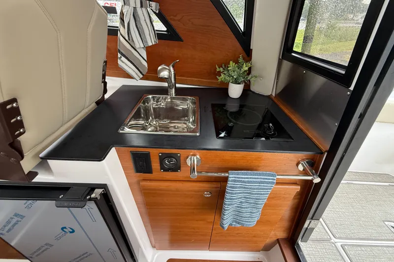 Slide: The Image of Compact kitchen area in 2026 Cutwater C-248 Coupe with sink and stove. - 15