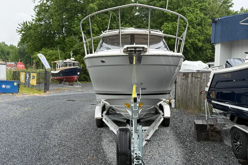 Slide: The Image of 2026 Cutwater C-248 Coupe boat on trailer in outdoor storage area. - 9