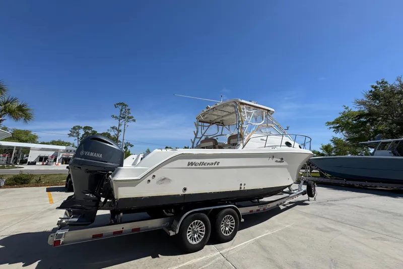 Slide: The Image of 2004 Wellcraft 290 Coastal boat on trailer with Yamaha outboard motor. - 12