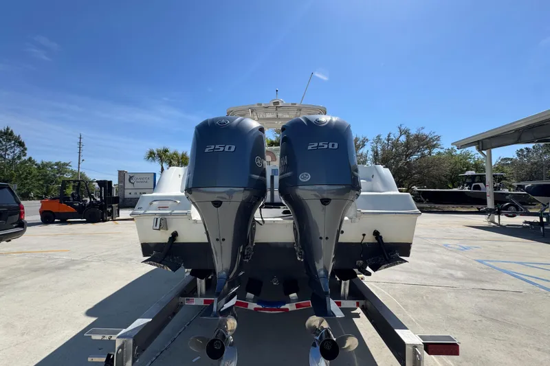 Slide: The Image of 2004 Wellcraft 290 Coastal boat with dual Yamaha 250 outboard engines on a trailer. - 14