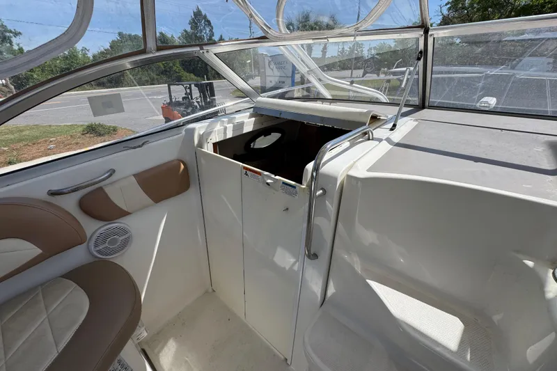 Slide: The Image of 2004 Wellcraft 290 Coastal boat interior with seating and helm area. - 25