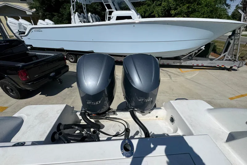 Slide: The Image of 2004 Wellcraft 290 Coastal boat with twin 250 horsepower engines on a trailer. - 35