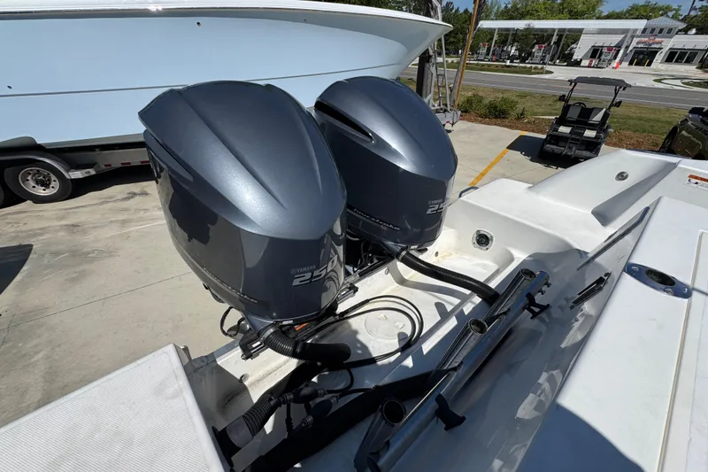 Slide: The Image of Twin Yamaha 250 outboard engines on a 2004 Wellcraft 290 Coastal boat. - 37