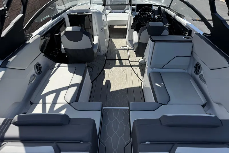 Slide: The Image of 2024 Yamaha Boats 252XE interior with sleek seating and modern design. - 11