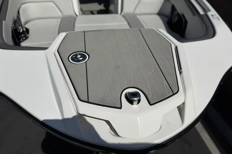 Slide: The Image of 2024 Yamaha Boats 252XE bow with sleek design and modern seating. - 12