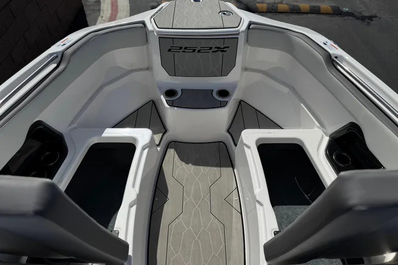 Slide: The Image of 2024 Yamaha Boats 252XE interior with sleek seating and modern design. - 16