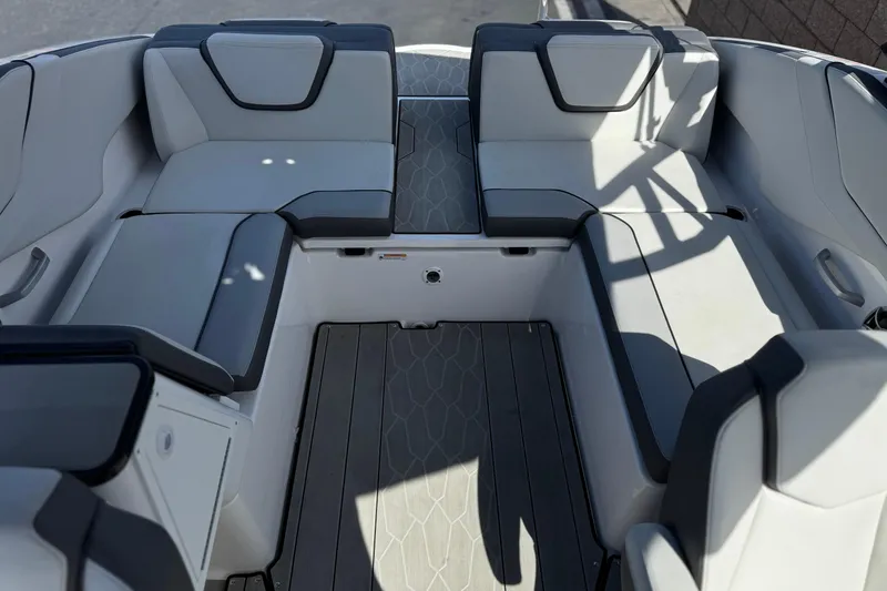 Slide: The Image of 2024 Yamaha Boats 252XE interior with sleek, modern seating and stylish design. - 22