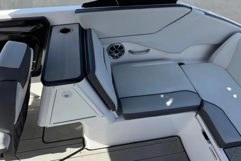 Slide: The Image of 2024 Yamaha Boats 252XE interior seating with sleek design and integrated speaker system. - 25