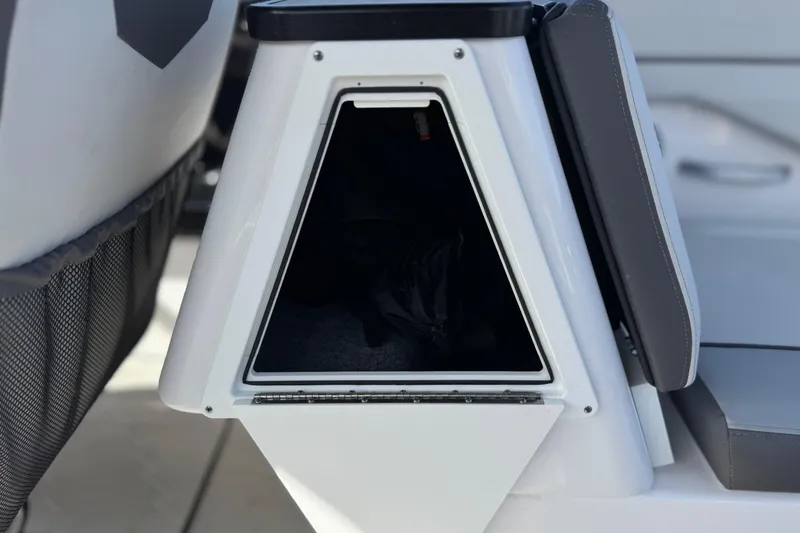 Slide: The Image of Storage compartment on 2024 Yamaha Boats 252XE, featuring sleek design and modern seating. - 28