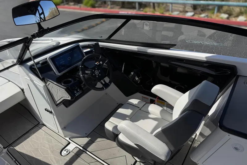 Slide: The Image of 2024 Yamaha Boats 252XE cockpit with modern steering and dashboard controls. - 34