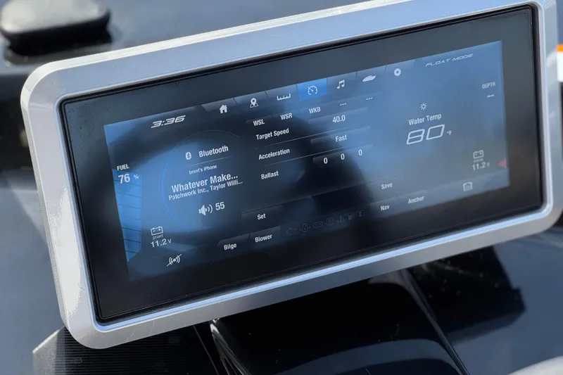 Slide: The Image of 2024 Yamaha Boats 252XE touchscreen display showing fuel, Bluetooth, and water temperature. - 39