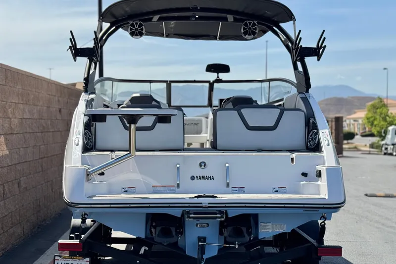 Slide: The Image of 2024 Yamaha Boats 252XE rear view, showcasing sleek design and modern features. - 4
