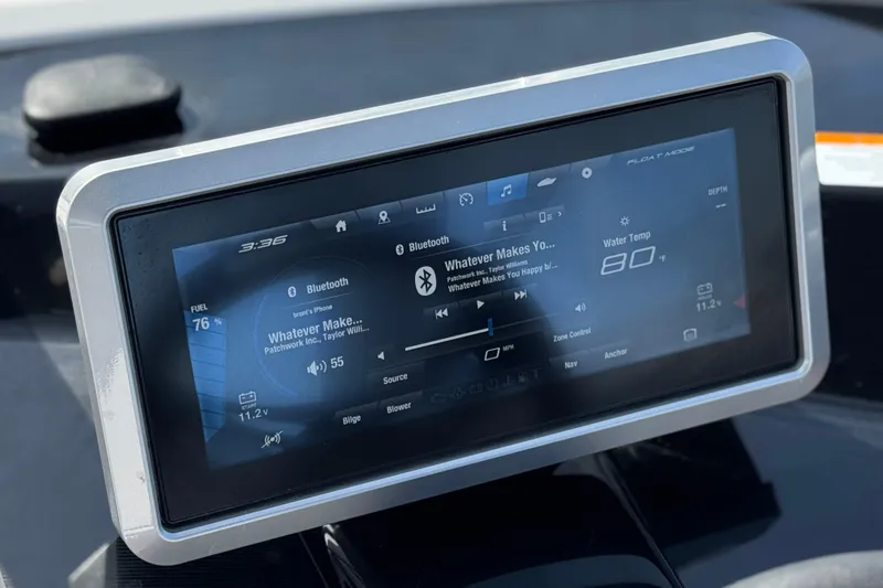 Slide: The Image of Touchscreen display on 2024 Yamaha Boats 252XE showing music and boat controls. - 40