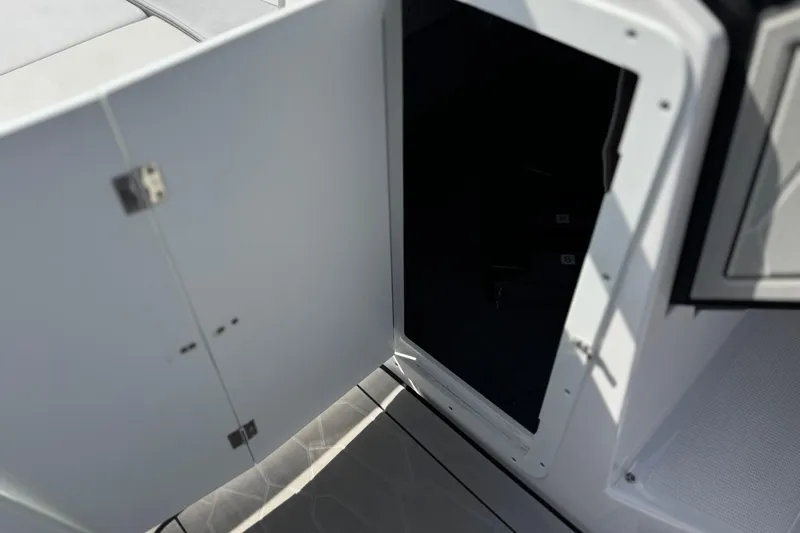 Slide: The Image of Open storage compartment on 2024 Yamaha Boats 252XE, showcasing interior space and design. - 43
