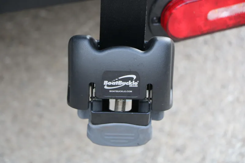 Slide: The Image of BoatBuckle strap on Vexus ADX 190, 2026 model, near red tail light. - 17