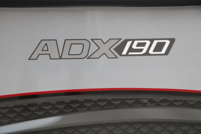 Slide: The Image of Vexus ADX 190 logo on sleek surface, 2026 model design. - 19