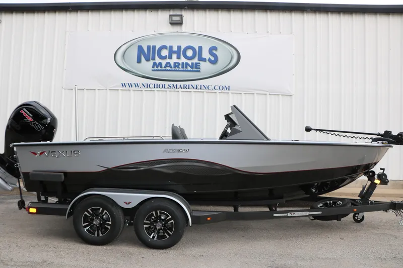 Slide: The Image of 2026 Vexus ADX 190 boat on trailer at Nichols Marine dealership. - 2