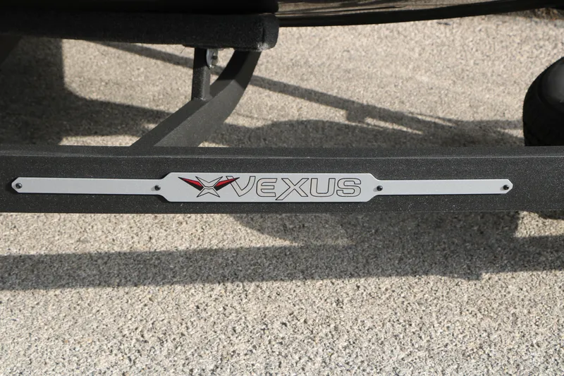 Slide: The Image of Vexus ADX 190 2026 logo on a boat trailer, displayed on a textured surface. - 20