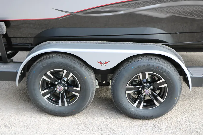 Slide: The Image of 2026 Vexus ADX 190 trailer wheels with sleek black rims and Load Star tires. - 21