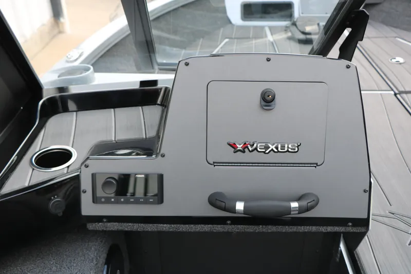 Slide: The Image of 2026 Vexus ADX 190 boat console with control panel and cup holder. - 24