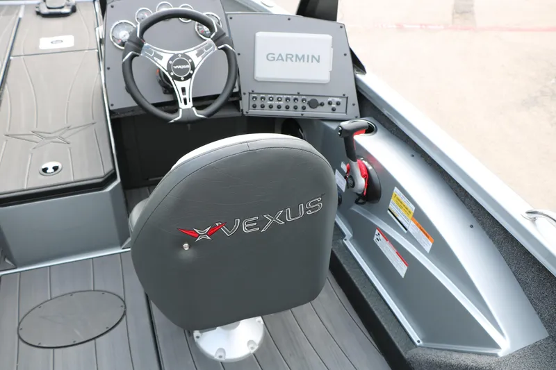 Slide: The Image of Interior of 2026 Vexus ADX 190 boat with Garmin navigation system and steering wheel. - 28