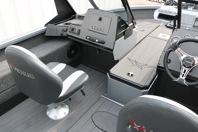 Slide: The Image of Interior of 2026 Vexus ADX 190 boat featuring sleek seating and modern dashboard design. - 29