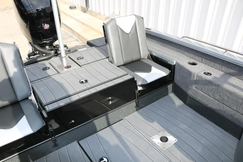 Slide: The Image of 2026 Vexus ADX 190 boat interior with gray seating and storage compartments. - 30
